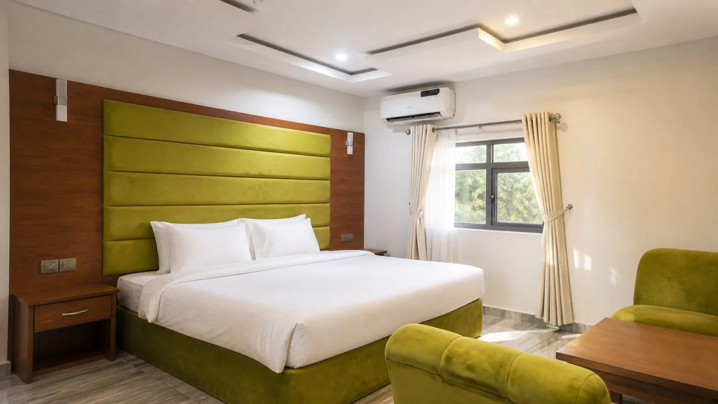 Editorial view of a Ternopil Dew guest room with a lime upholstered headboard.