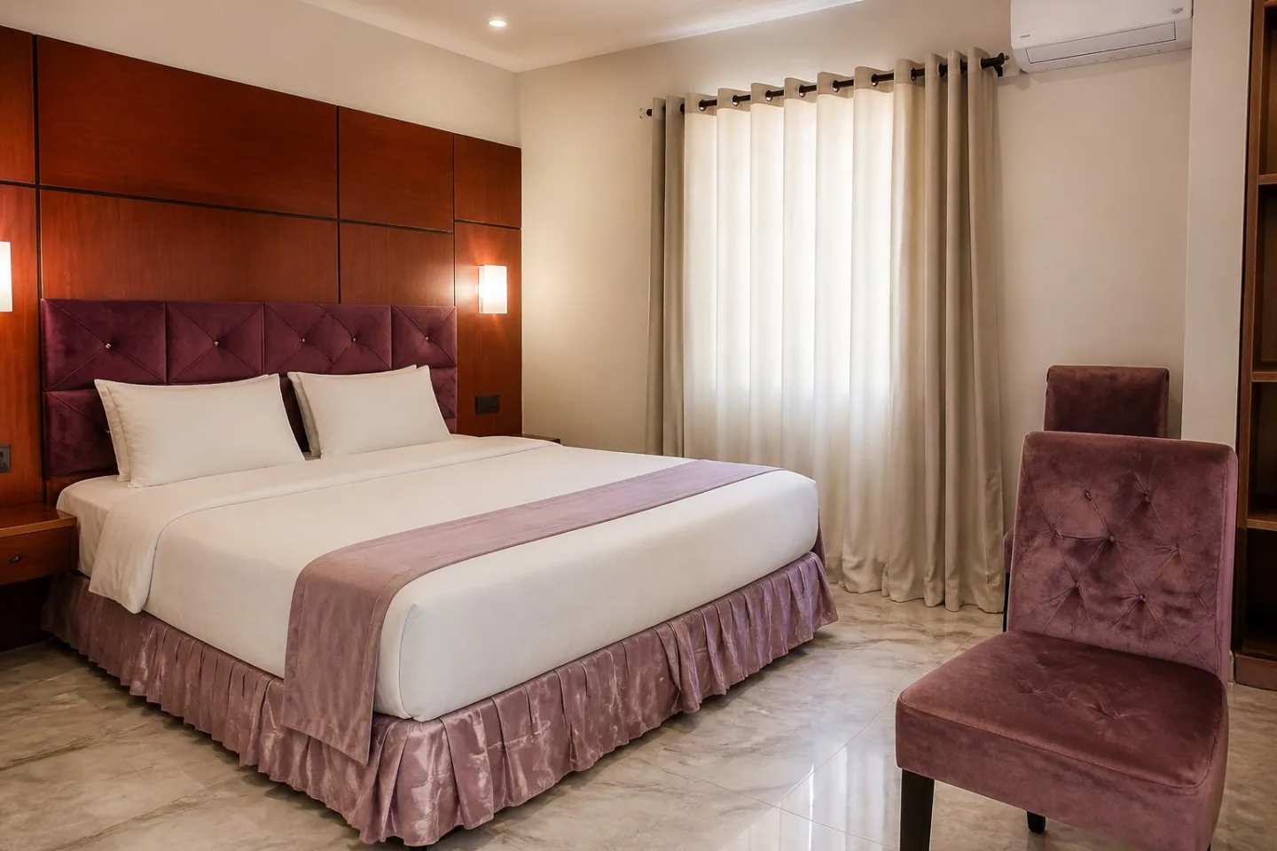 Editorial view of a Ternopil Dew guest room with plum upholstery and warm wood panels.